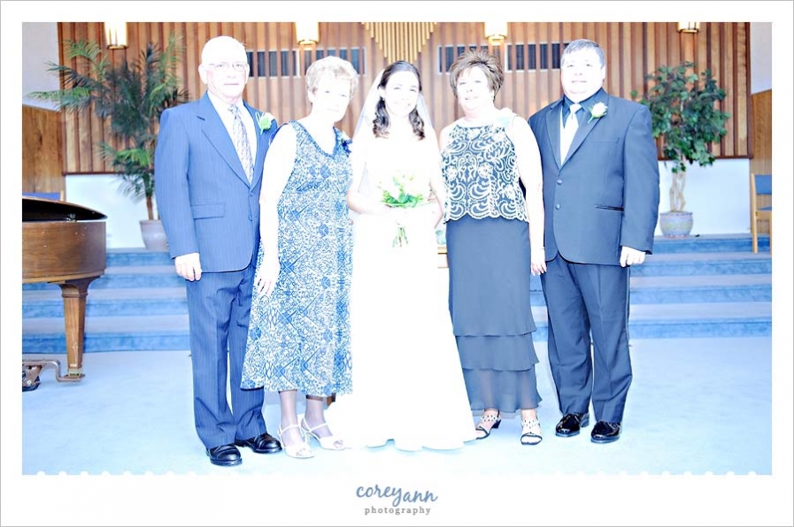 guest flash during formal portrait of family during wedding