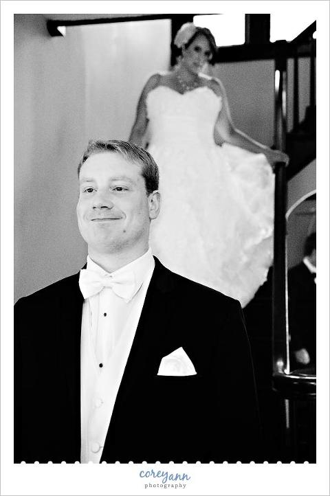bride and groom doing first look on staircase at home in akron ohio