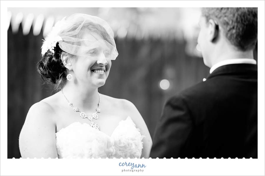 bride smiling during vows at wedding ceremony in akron ohio