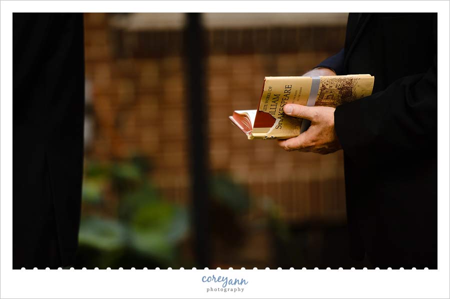 Shakespeare book holding wedding rings