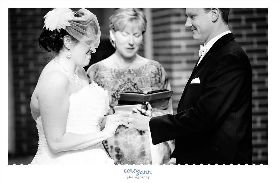 ring exchange during wedding ceremony in backyard