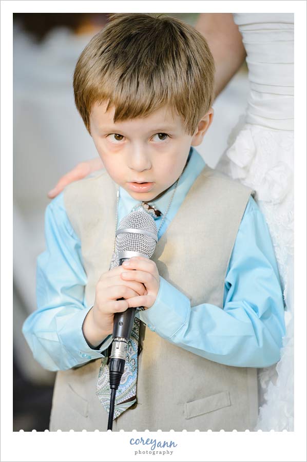 ring bearer singing soft kitty during reception