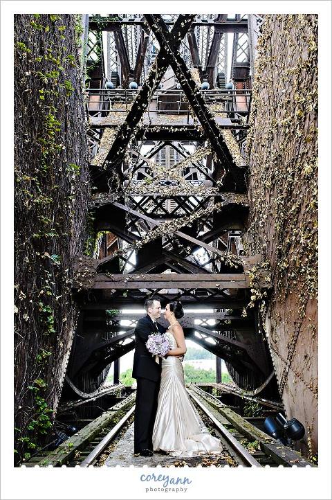 bride and groom on bridge near shooters on the flats