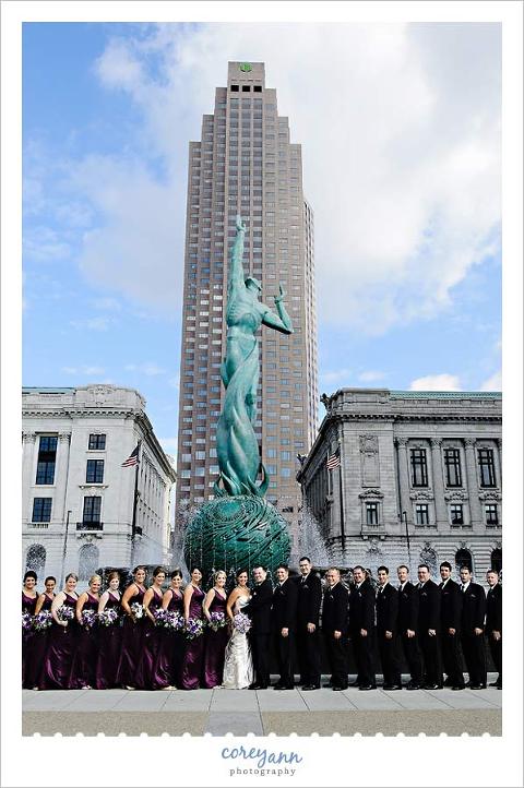 bridal party in downtown cleveland at fountain of eternal life