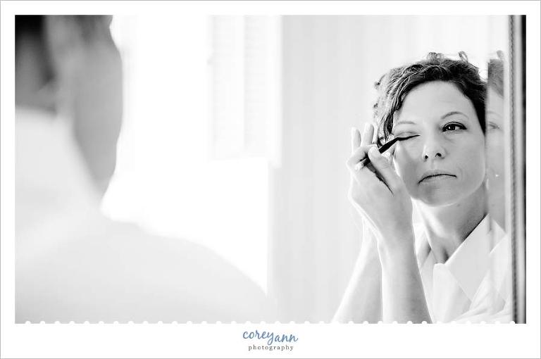 bride getting ready in front of window in Hanoverton Ohio