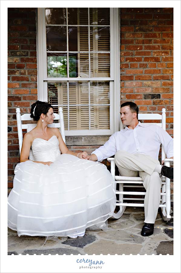 bride and groom on rocking chairs