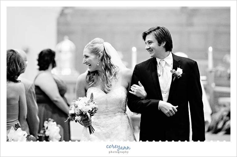 bride and groom smiling during recessional