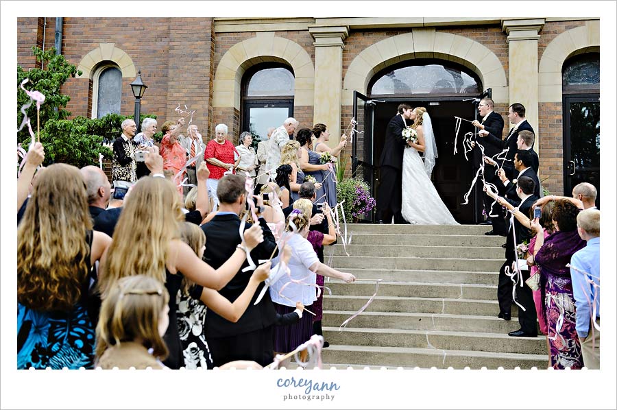 Jenny & John's Wedding bride and groom exit from ceremony with ribbon wands