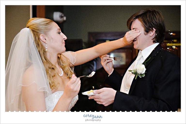 bride smashing cake into groom's face