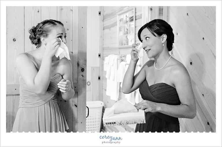 bridesmaids crying after seeing bride for the first time