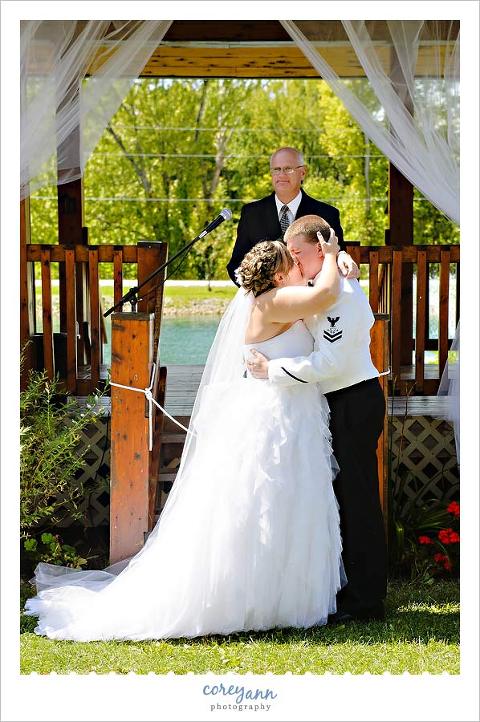 first kiss at wedding ceremony at hope cabins in galion ohio