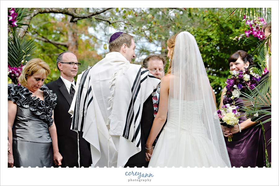 Stephanie and Mark's Wedding bride and groom smiling at each other during wedding ceremony at landerhaven