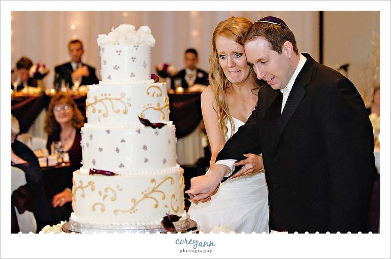 bride making a face during cake cutting