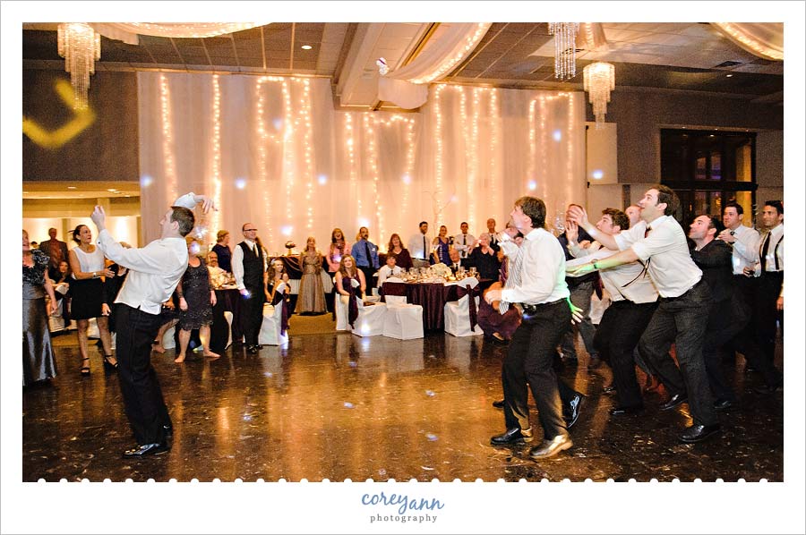 Stephanie and Mark's Wedding groom tossing the garter