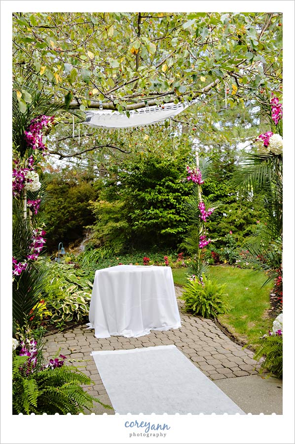 Stephanie and Mark's Wedding chuppah at landerhaven made with orchids and apple tree