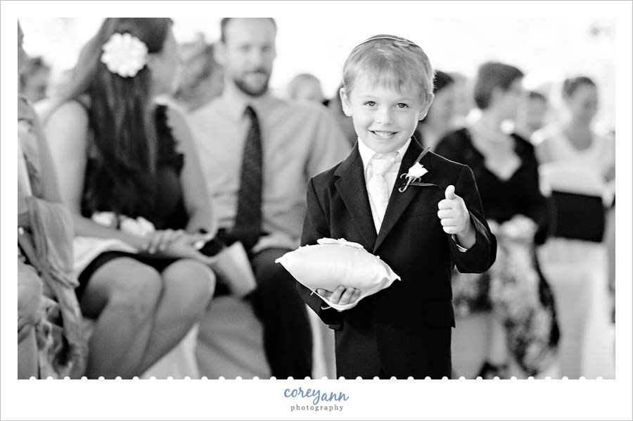 Stephanie and Mark's Wedding ring bearer giving a thumbs up during wedding processional