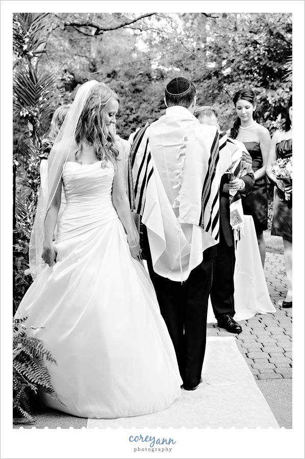 Stephanie and Mark's Wedding bride circling groom during a jewish ceremony at landerhaven