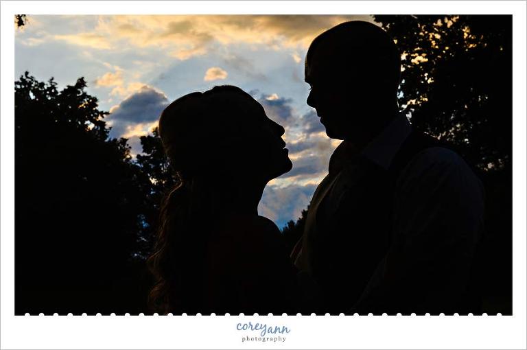 bride and groom silhouette portrait during sunset