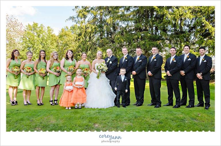 orange and green bridal party outside in akron ohio