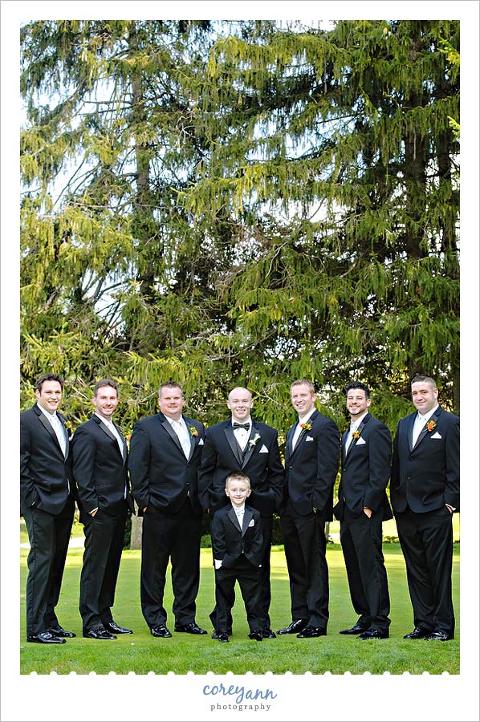 groomsman with ringbearer outside in september at portage country club
