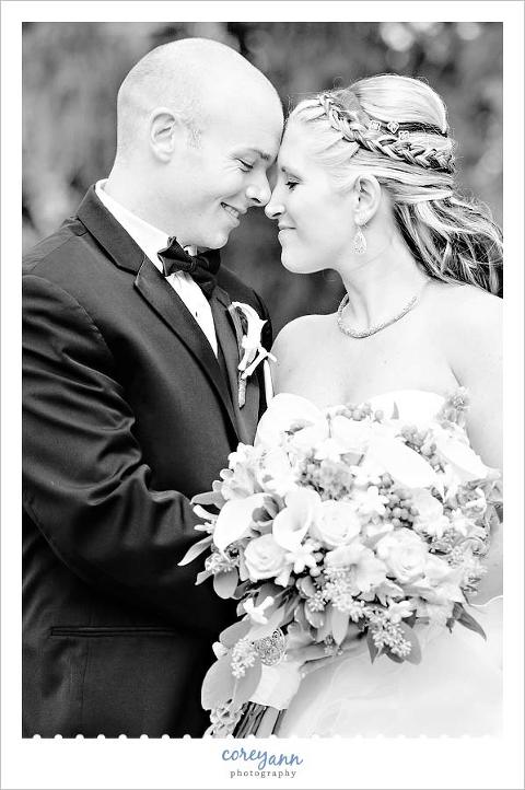 black and white portrait of bride and groom before wedding at portage country club