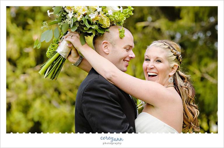 bride laughing during portraits outside on golf course