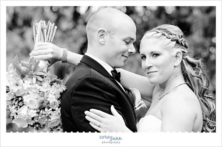 Bride and groom black and white portrait with bouquet
