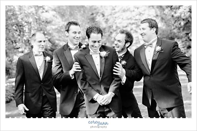 groomsman and groom during wedding portrait session in youngstown ohio