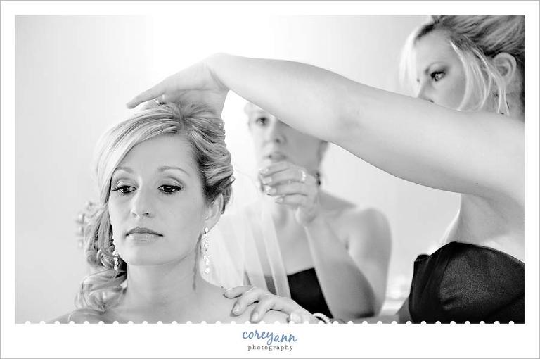 bride getting veil put in before wedding ceremony