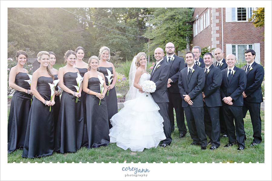 black and white bridal party with cala lilies