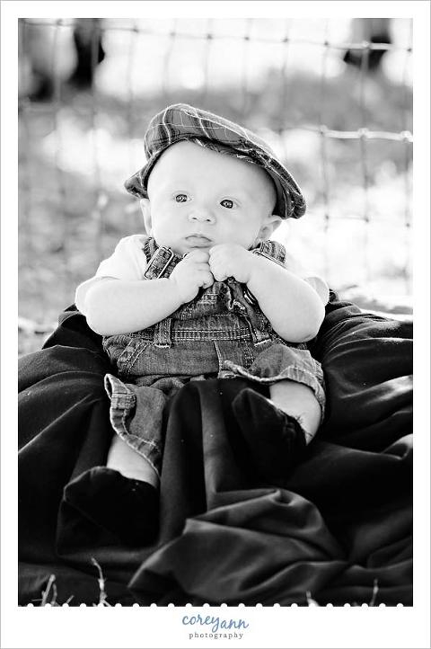 black and white baby portrait with hat on