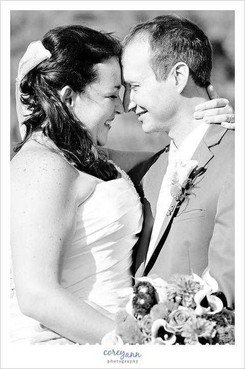 black and white portrait of bride and groom nuzzling in Ohio