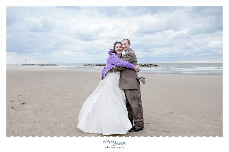 bride and groom on beach on lake erie in ohio