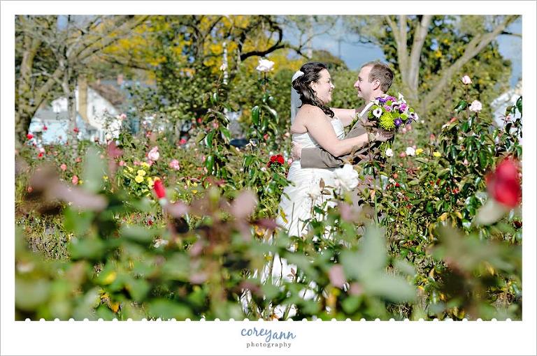 bride and groom in rose garden at lakeview beach