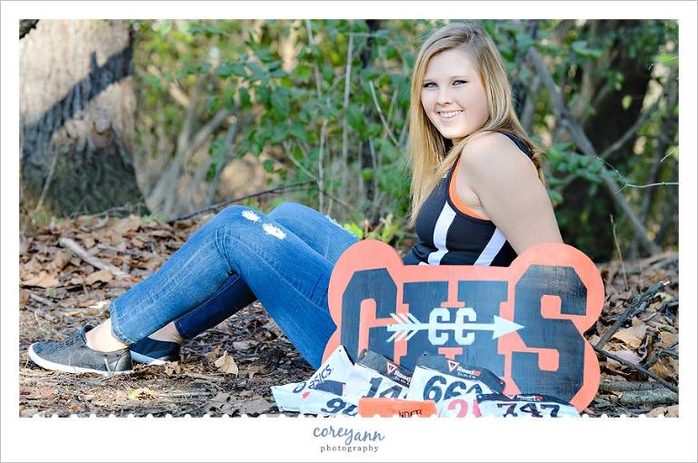 senior picture with cross country sign and numbers