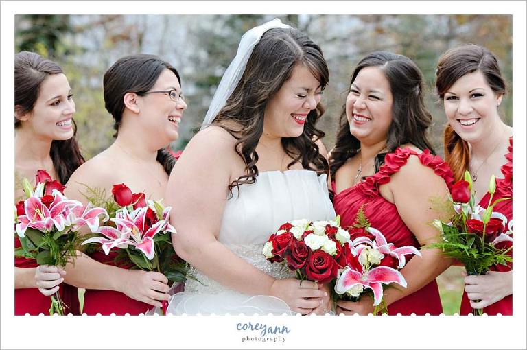 bridesmaids and bride laughing during wedding portraits