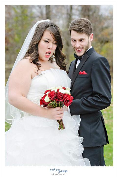 bride and groom making silly faces in wedding portrait