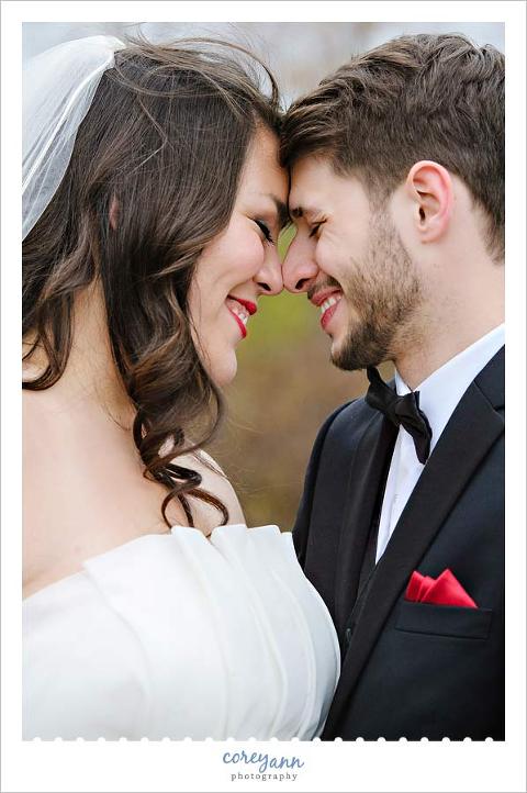 bride and groom touching foreheads in wedding picture