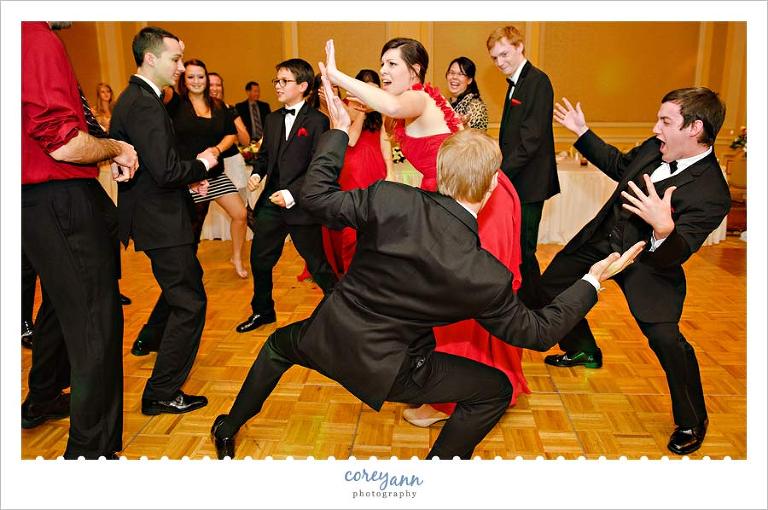 bridal party dancing to gangham style during wedding reception
