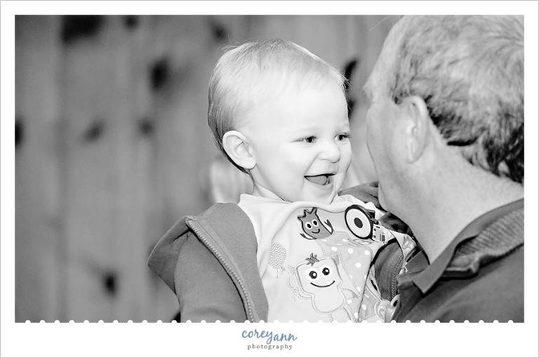 grandfather and grandson laughing during birthday party