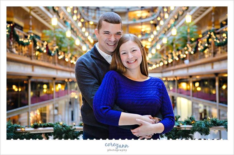 engagement session during holidays at the hyatt arcade in cleveland