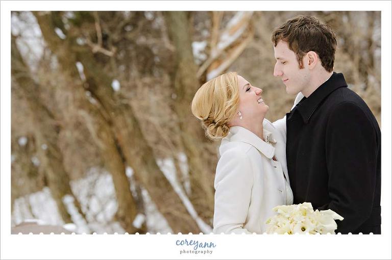 bride and groom outdoors in december for wedding pictures