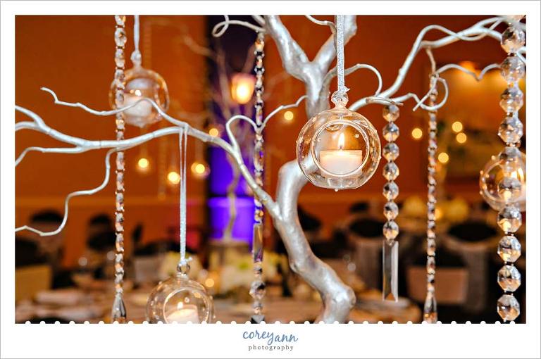 silver tree centerpiece with crystals and candle orbs