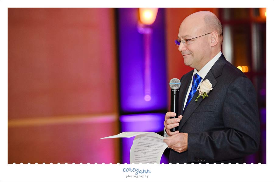 father of bride greeting guests at wedding reception at the club at key center