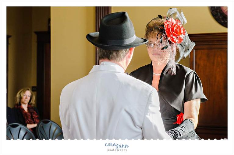 bride wearing black wedding dress with black cage veil