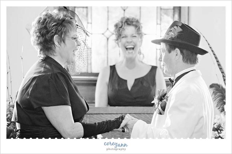 bride and groom laughing during wedding ceremony
