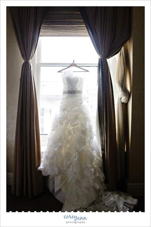 wedding dress hanging in the window at the hyatt arcade