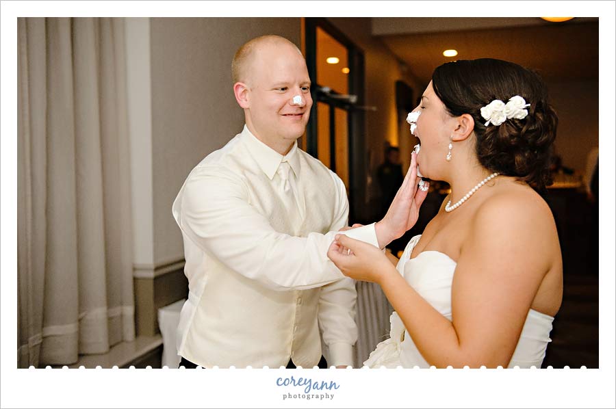 Nancy Bride Talk groom smashing cake on bride's face during wedding reception
