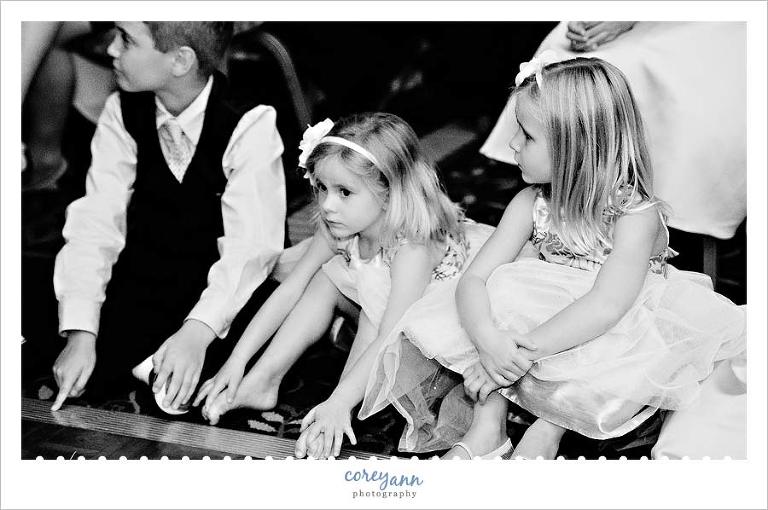 little kids waiting to dance during wedding reception