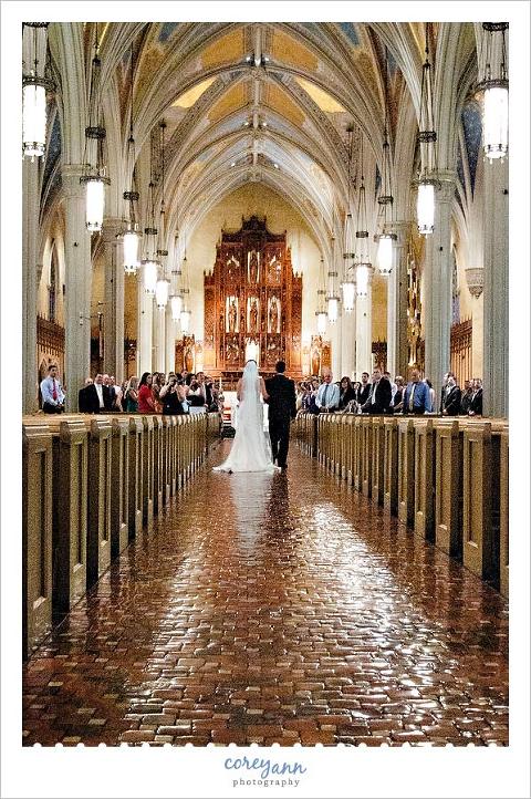 bride walking down the aisle at st john the evangelist in cleveland ohio